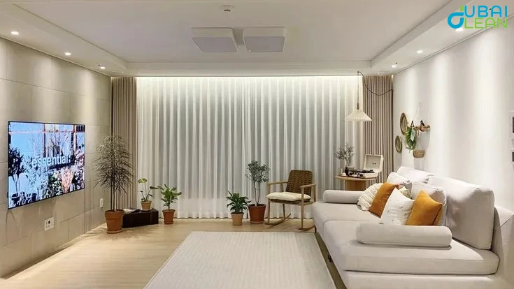 Person performing apartment deep cleaning using professional tools and supplies.