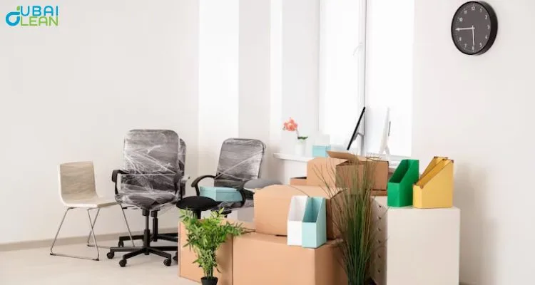 Professional office wrapping service team carefully packing and wrapping office furniture and equipment for safe relocation