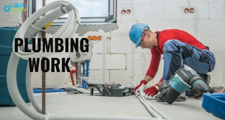 Skilled plumber performing plumbing work in Dubai residence, showcasing professional pipe fitting and installation services.