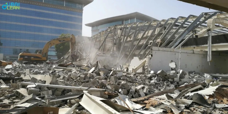 Excavator performing villa teardown as part of professional demolition services in Dubai